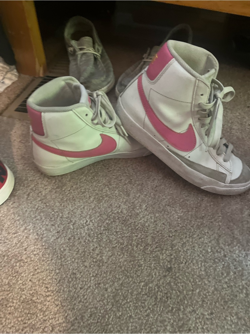 Nike White High-Top Sneakers with Pink Swoosh